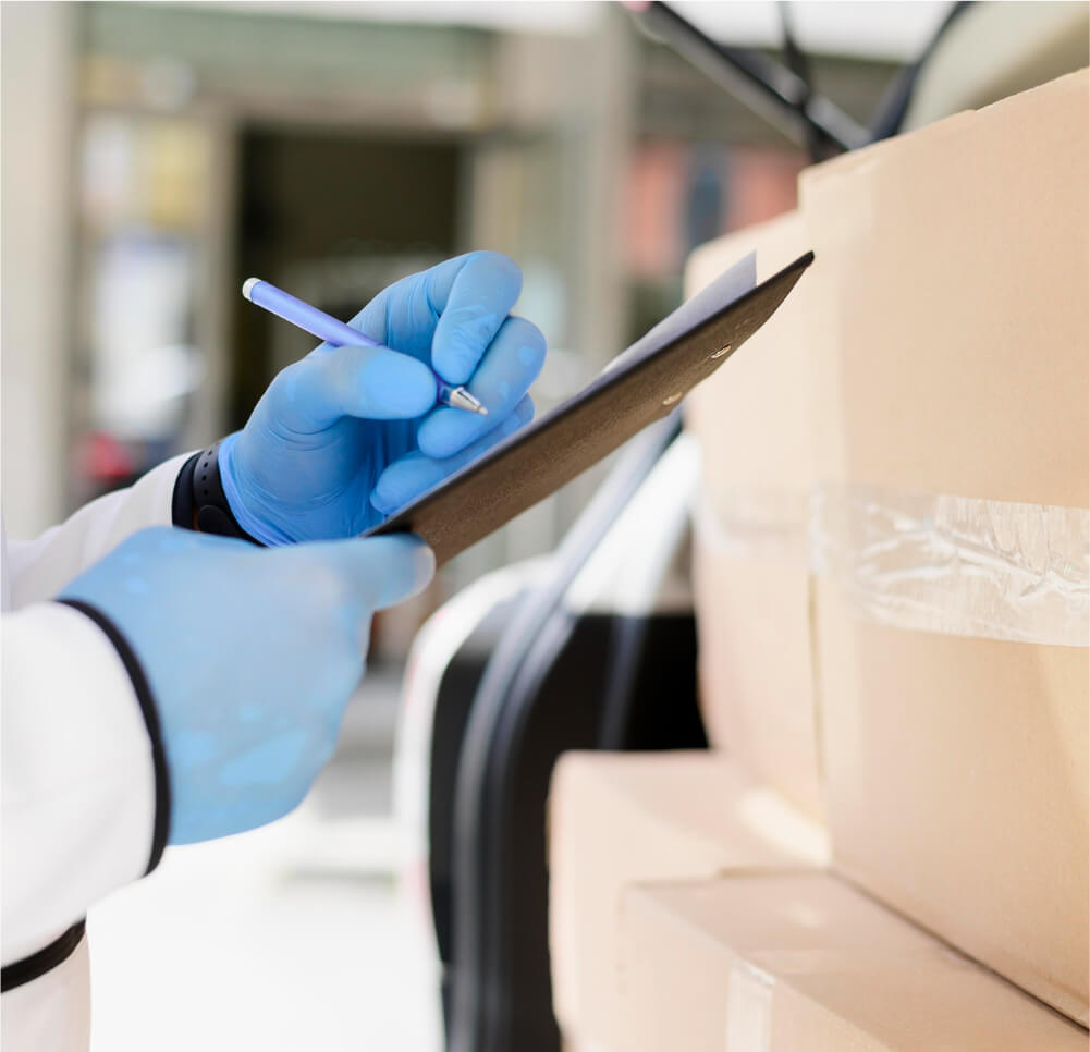 close-up-individual-checking-delivery-list-re-op