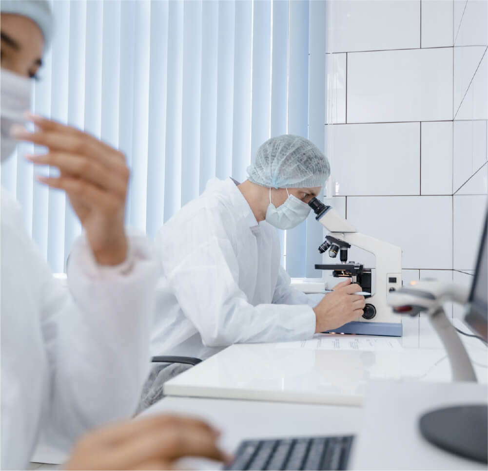 man-looking-at-a-microscope-re-op